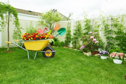 Stylish Hillingdon garden design with paving, borders, and layered plants